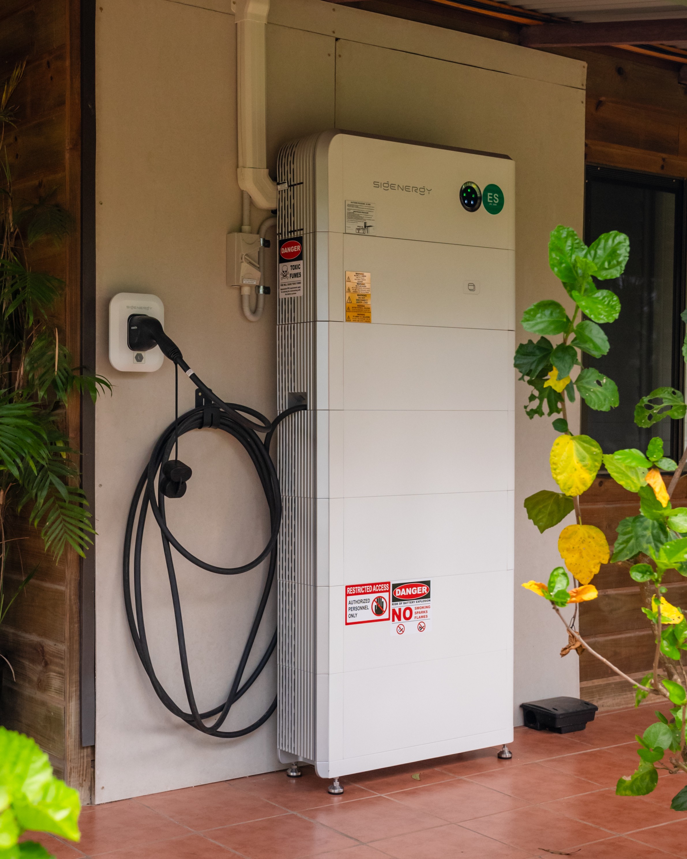 Battery and EV charger installed on a house wall