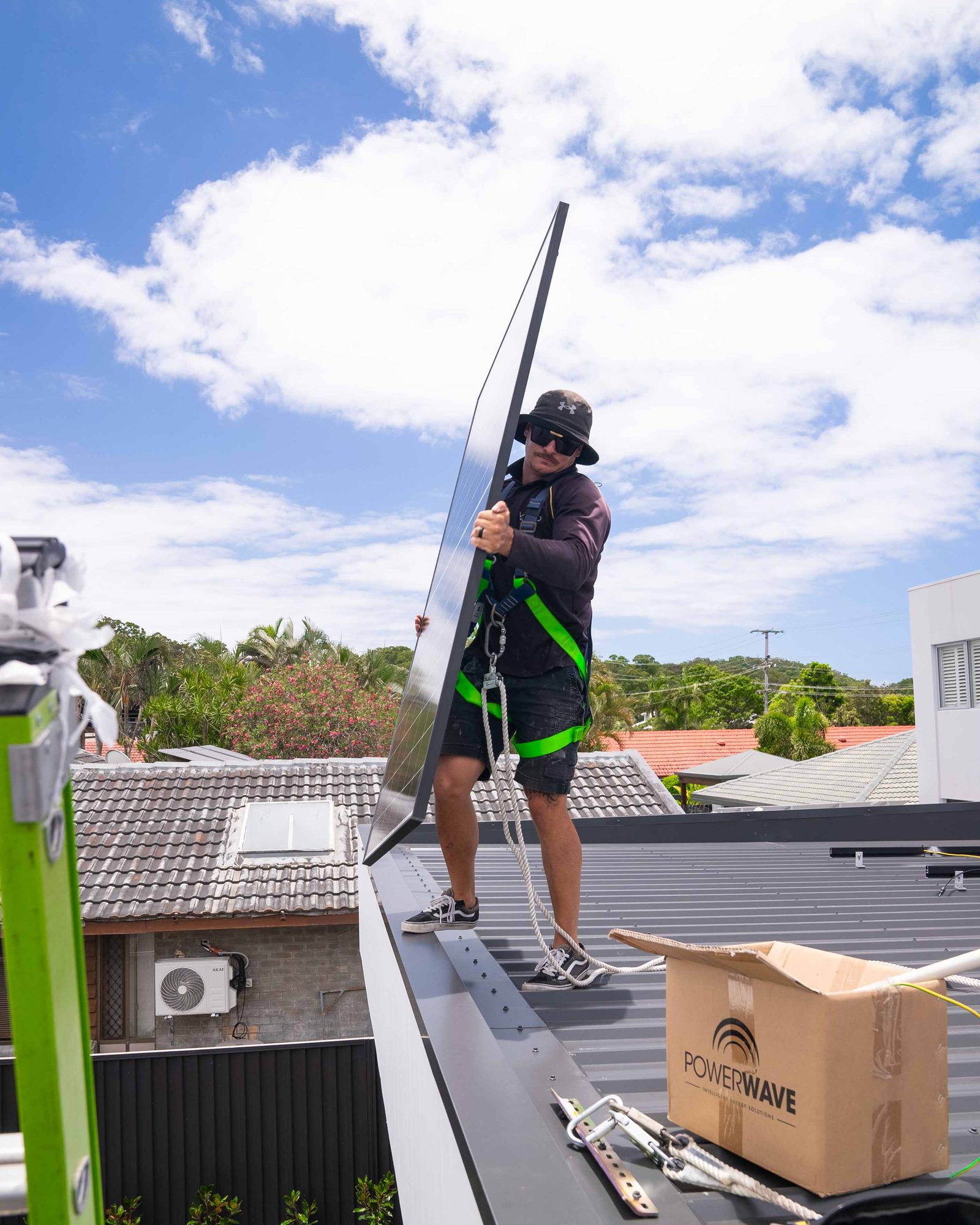 Installer climbing to the roof